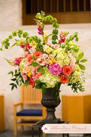 Welcome to impressive enterprises, inc., a leading importer and wholesaler of unique seasonal holiday products, silk floral, home decor and gifts. Hot Pink Orange Yellow Green Altar Arrangement Significanteventsoftexas Com Altar Flowers Wedding Altar Flowers Alter Flowers