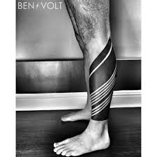 Black And White Calf Tattoos For Men Finished This Dynamic Linear And Triangular Leg Armor For Aaron Thanks So Much Bud Benvolt Blackwork Tattoo Ta Tattoos Geometric Tattoos Men Armor Tattoo