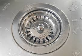 close up stainless steel sink plug hole