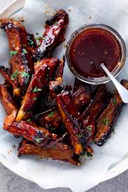 Place the riblets in a large roasting pan and bake in the preheated oven, uncovered, for 45 minutes. Easy Sticky Lamb Ribs Simply Delicious