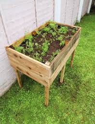 Create a great focal point in your garden by building this standing raised garden bed. How To Make A Raised Garden Bed With Legs Dainty Dress Diaries