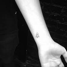 Black And White Rocket Tattoo Tiny Rocket Tattoo On The Left Inner Wrist Rocket Tattoo Planet Tattoos Rocket Ship Tattoo