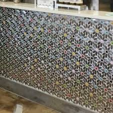 In this spacious and colorful kitchen wood is the main element, which not only dominates the floor but remains constant on the cabinetry and the island. Red Barrel Studio Ifetayo Daisy Chain Glass Stainless Steel Mosaic Tile In Brown Gray Wayfair