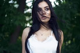 Trousers holding hands in pockets while. Hd Wallpaper Women Model Dark Hair Hair In Face Brown Eyes Looking Away Wallpaper Flare