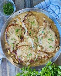 A Delicious Comfort Food Meal Pan Seared Bone In Pork Chops Are Smothered In A Creamy Mushroom Gr In 2021 Comfort Food Recipes Dinners Smothered Pork Chops Pork Chops