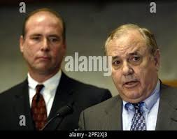 Indiana Gov. Joe Kernan, right, gets a hug from Donna Imus as he leaves the  Statehouse for lunch in Indianapolis, Monday, Sept. 15, 2003. Kernan was  sworn in as governor Saturday after