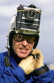 Sergeant Mark Perry, a member of the Royal Air Force Falcons Parachute  Demonstration Team, unstraps the helmet camera he used to take aerial  photographs during Air Fete '85