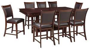 And with the look of reclaimed barn wood, this table is an inspired choice for modern farmhouse living. Collenburg Counter Height Dining Table And 8 Barstools D564 32 124 8 Dining Room Groups Rogers Furniture