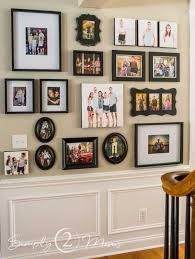 Jagged lines on the top and bottom accentuate the arrangement. How To Plan And Install A Front Entry Gallery Wall Simply2moms
