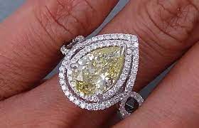 Halo Canary Yellow Pear Shaped Diamond Engagement Ring Pear Shaped Diamond Engagement Rings Diamond Engagement Ring Designs Diamond Engagement Rings