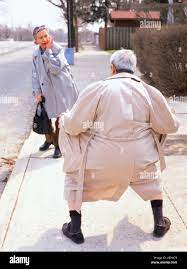 Older man flashing woman outdoors Stock Photo - Alamy
