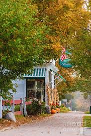 Among new england village greens, connecticut's are large; Autumn In A New England Village Photograph By Don Landwehrle