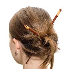 A bun is a type of hairstyle in which the hair is pulled back from the face, twisted or plaited, and wrapped in a circular coil around itself, typically on top or back of the head or just above the neck. Buns For Short Hair 15 Easy Hairstyles To Try