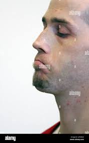 Earl Mann listens to court proceedings after pleading guilty to murder and  rape