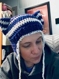 Juan is not pleased with the new hobby of its human 😡 [this was supposed  to be a hat, my first time crocheting lmaooo]