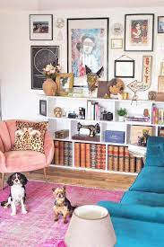 Color Filled Living Room Bright Vintage Pink Rug Meets Its Match With A Blue Velvet Sofa In This Pink Rug Living Room Velvet Sofa Living Room Pink Living Room