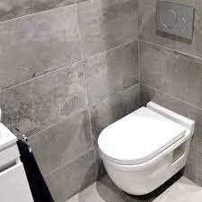 toilet idee betonlook vloer en wandtegels badkamer tegel badkamer toilet