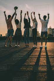 Night aesthetic city aesthetic couple aesthetic summer aesthetic aesthetic pictures •this is a 30 or 50 4x6 photo retro coming of age aesthetic photo wall kit! Silhouettes Of Group Of Happy Friends On Roof At Sunset Stock Photo Dissolve