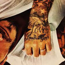David beckham shows off new hand tattoo of jay z's lyrics. Lead With Love David Beckham Tattoo David Beckham Tattoos Tattoo Beckham Hand Tattoos