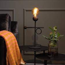 dutchbone loyd desk lamp is the little benjamin of the loyd family while the floor and wall lamp distinguish themselves with their black velvet lampshade loyd