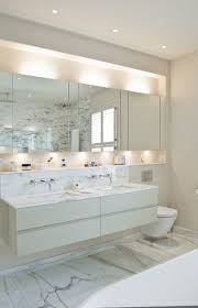 Rectangular bathroom mirrors are the most common because you can see your entire reflection and the symmetrical design fits in to mimic the rectangular shape of a bathroom vanity. 10 Gorgeous Ways To Light Your Bathroom Vanity Mirror Houzz Uk