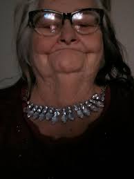 This is my mom can someone put pretty background. To make picture lighter  and pretty