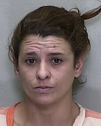 Woman accused of failing to help child