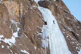 Jared climbing Joy After Pain in Cody, Wyoming