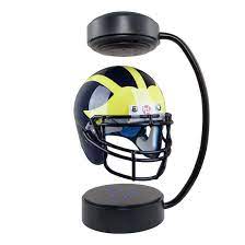 The helmet hangers make a great addition to any man cave that has trophy helmets on display. Hover Helmets University Of Michigan Football Floating Helmet