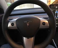 The logo can be seen on the steering wheel of tesla's model 3 electric car in a showroom. Teslahome Steering Wheel Covers Trim Car Interior Decoration Stainless Steel Case For Tesla Model 3 3pcs Set Amazon In Sports Fitness Outdoors
