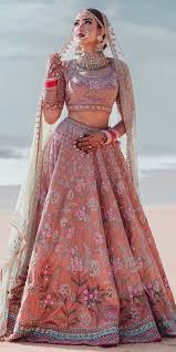 Everything in this picture can serve as an inspiration for your wedding look. 30 Exciting Indian Wedding Dresses That You Ll Love Indian Bride Outfits Indian Wedding Dress Wedding Lehenga Designs