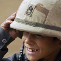 In a small village in northern Iraq, US Army (USA) Corporal (CPL) Travis  Melby, Task Force 1ST Battalion, 63rd Armor Regiment (1-63 Armor), Vilseck,  Germany, gives a local an inoculation against tuberculosis