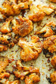 Sweet And Spicy Baked Cauliflower Recipe Roasted Cauliflower Recipes Veggie Dishes Spicy Roasted Cauliflower