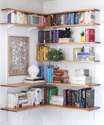 A corner bookcase saves floor space and gives you extra places to display collectibles, memorabilia and, of course, books! Corner Bookshelves Tutorial Bookshelves In Living Room Bookshelves In Bedroom Creative Bookshelves