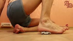 TRANNY GIANTESS SPOTTES A TOY CAR, CRUSHES IT BAREFOOT AND SITS ON IT  (CRUSH FETISH; FOOT FETISH)
