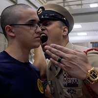 Chief Hospital Corpsman Dawn Calhoun, an instructor from Officer Training  Command Newport, R.I., inspects Navy Junior ROTC cadets.