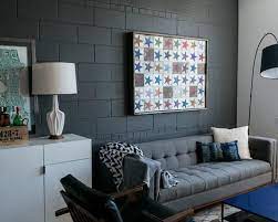 The cinder block wall should also be primed before painting to ensure an even and stronger finish. 22 Fun And Cheap Ideas For Diy Cinder Block Projects Living Room Grey Concrete Block Walls Grey Walls Living Room