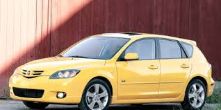 Adjustable front and rear headrests. 2004 Mazda 3 Road Test