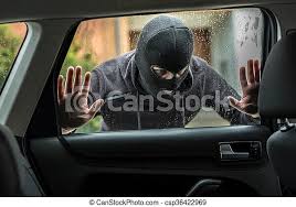 But experts have a pretty good hunch as to why an open car window is your dog's idea of a good time. Car Thief Looking Through Car Window Man Dressed In Black With A Balaclava On His Head Looking Through Car Window And Canstock