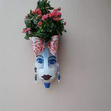 Use acrylic paint and colour them in a pastel colour. Milk Jug Planters With Faces Eco Friendly Diy Ideas Balcony Decoration Eco Friendly Garden Ideas