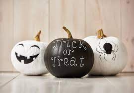 A pumpkin painted gold and a white pumpkin with gold leaves on it are cool and chic fall decorations. 5 Ways To Decorate A Pumpkin Without Carving Into Them Quicken Loans