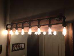 Bathroom vanity lights, bathroom lights, bathroom lighting, bathroom vanity light fixture, wood sconce, country rustic farmhouse decor lamp we replaced our old bathroom vanity lights. Pin On What I Ve Done