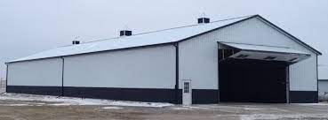 From basic to bold, morton buildings builds the finest pole barns, equestrian buildings, steel buildings and more. íŠ¸ìœ„í„°ì˜ Apb Pole Barns ë‹˜ 60x150x16 With Bi Fold Hangar Door Brite White Siding And Roofing With Shiny Black Steel Trim And Wainscot Two 36 Cupola With One 48 In Center Iowapolebarns Polebarnstorage