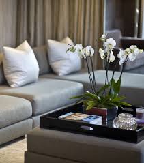 The components that create a chic coffee table are a mix of functional and decorative. Pin By Kamiliya Sultan On Donghia Showrooms Ottoman Decor Decorating Coffee Tables Home Decor