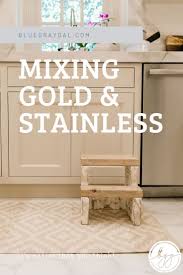 Cooking delicious meals is now easy with utilitarian kitchen appliances. Convincing You That Mixing Metals In Kitchen Decor Is Awesome Bluegraygal Mixing Metals In Kitchen Kitchen Lighting Design Two Tone Kitchen