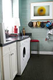 Love this fun laundry room done by @erinhansendesign the wallpaper is to die for & a huge hint as to what you'll be seeing our designs on next @staggdesignshop ! 50 Small Laundry Room Ideas Small Laundry Room Storage Tips