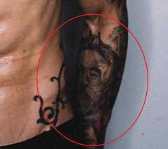He has a tattoo of large flowers on his neck and serial killer albert fish' on his left forearm. Justin Thomas Tattoo On Elbow Meaning Taotcr