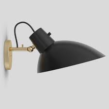 An electric light fixture patterned on a candle sconce. Elegant Mid Century Wall Sconce By Vittoriano Vigano Cinquanta Casa Lumi