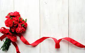 A Bouquet Of Flowers Carnation With A Red Ribbon On Wooden Table Photo Flower Beautiful Flowers Wallpapers Flower Backgrounds Flower Wallpaper