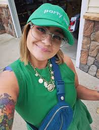 Why is a woman taking pictures of front doors and grabbing door handles in  Grand Blanc, Michigan?